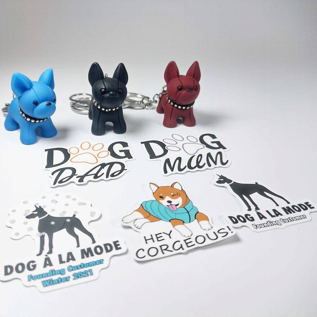 Dog A La Mode free gift pack containing beautiful custom dog stickers and different coloured dog keychains