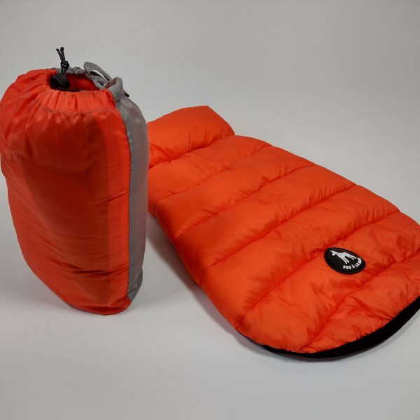 Dog A La Mode orange reversible dog puffer jacket back view with the bag