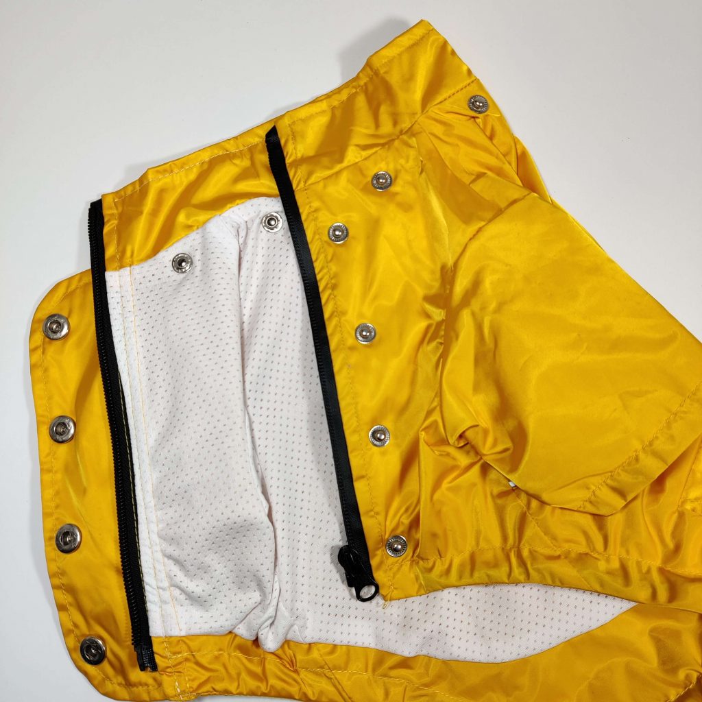 Dog A La Mode's new yellow waterproof dog Buddy raincoat with a breathable polyester mesh lining to reduce moitsure and increase circulation for all dogs