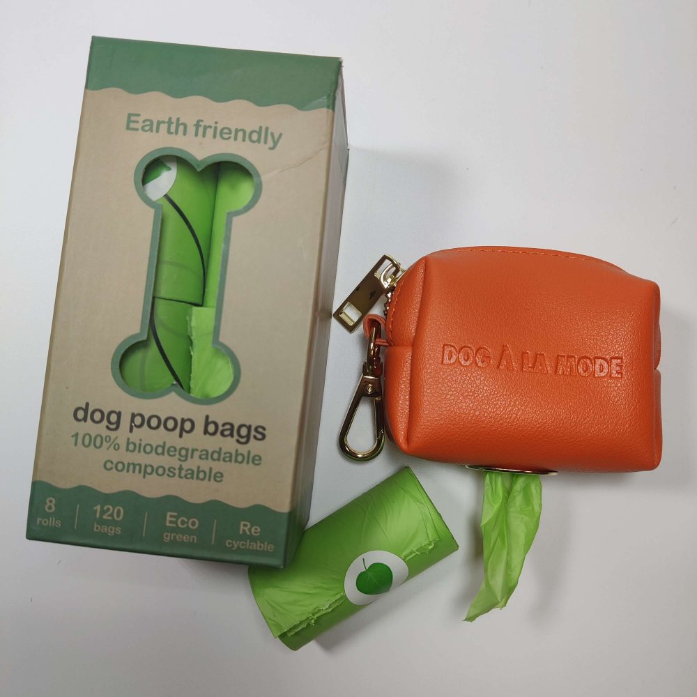 Dog A La Mode orange vegan dog poop bags holder with fully biodegradable and compostable earth rated dog poop bags bundle